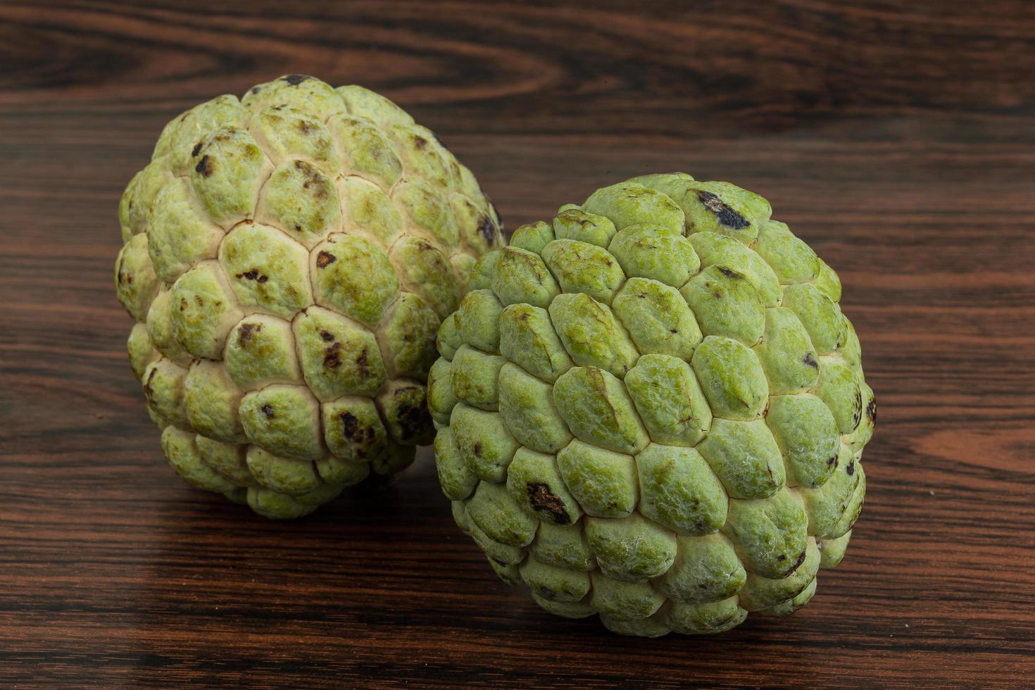 Custard apple on wooden background photo
