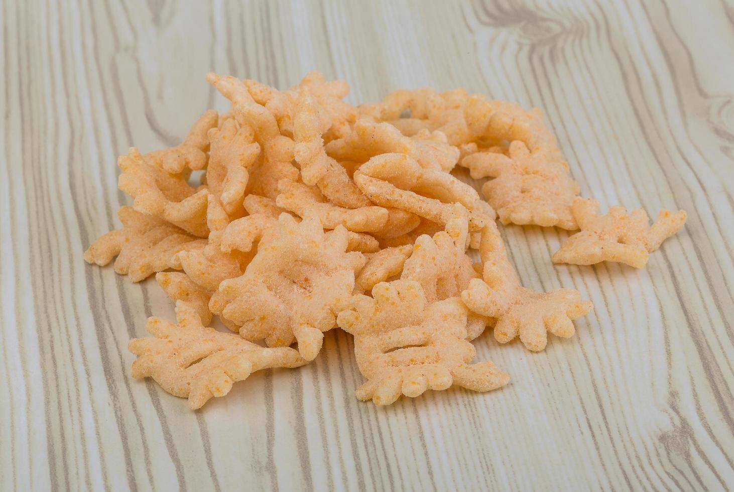 Chips on wooden background photo