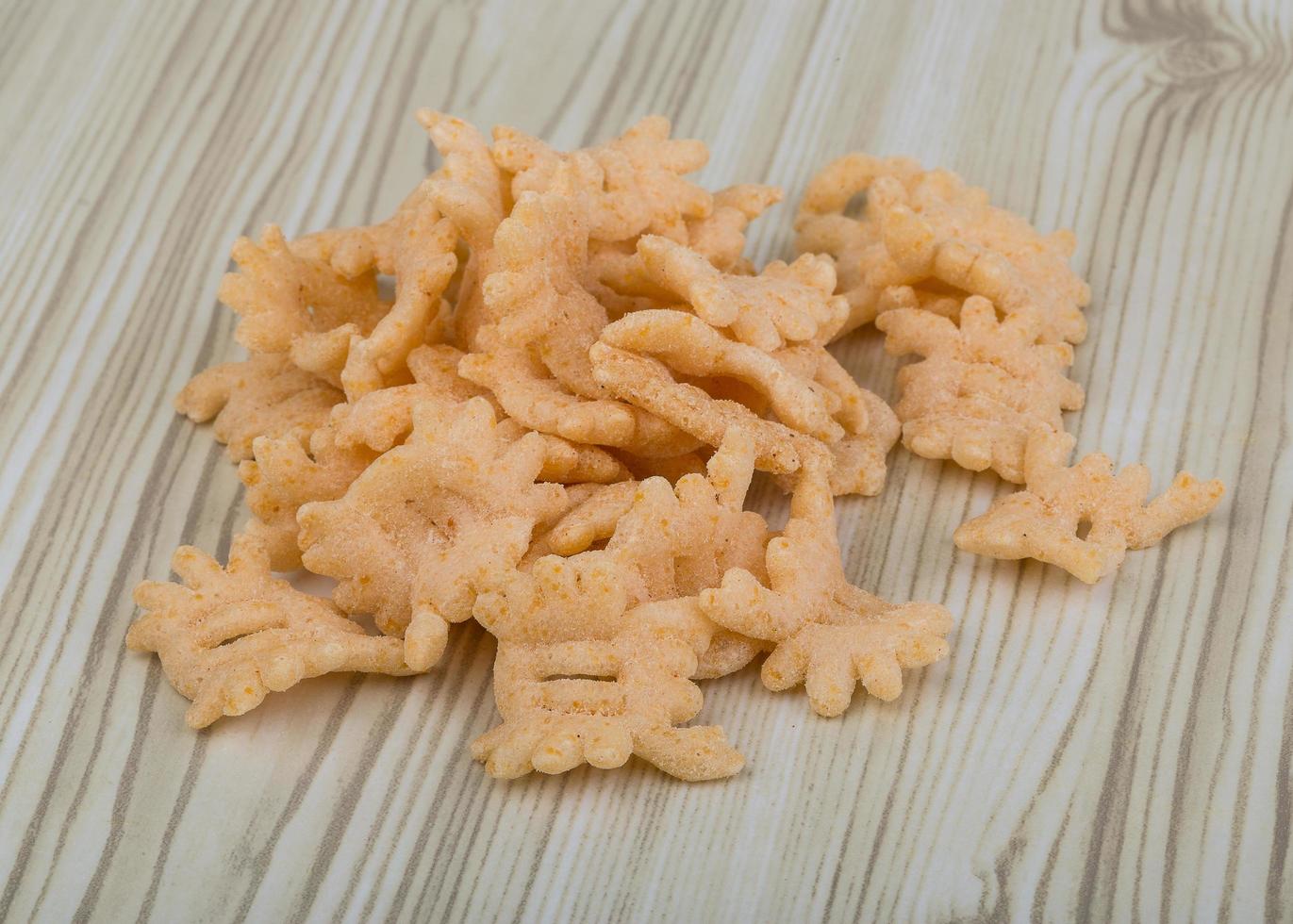 Chips on wooden background photo