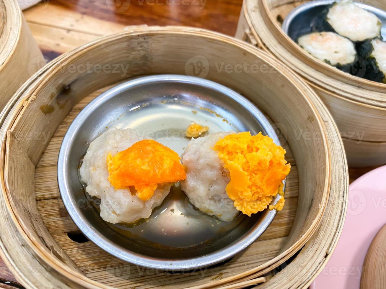 Dim sum top view and text input area, dim sum Chinese food in steamed bamboo is popular all over the world. photo