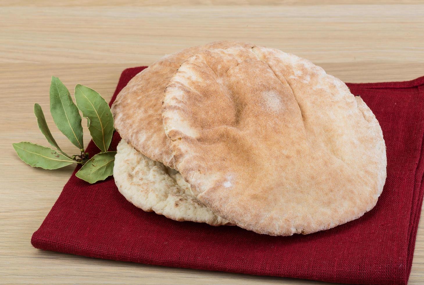 Pita on wooden background photo