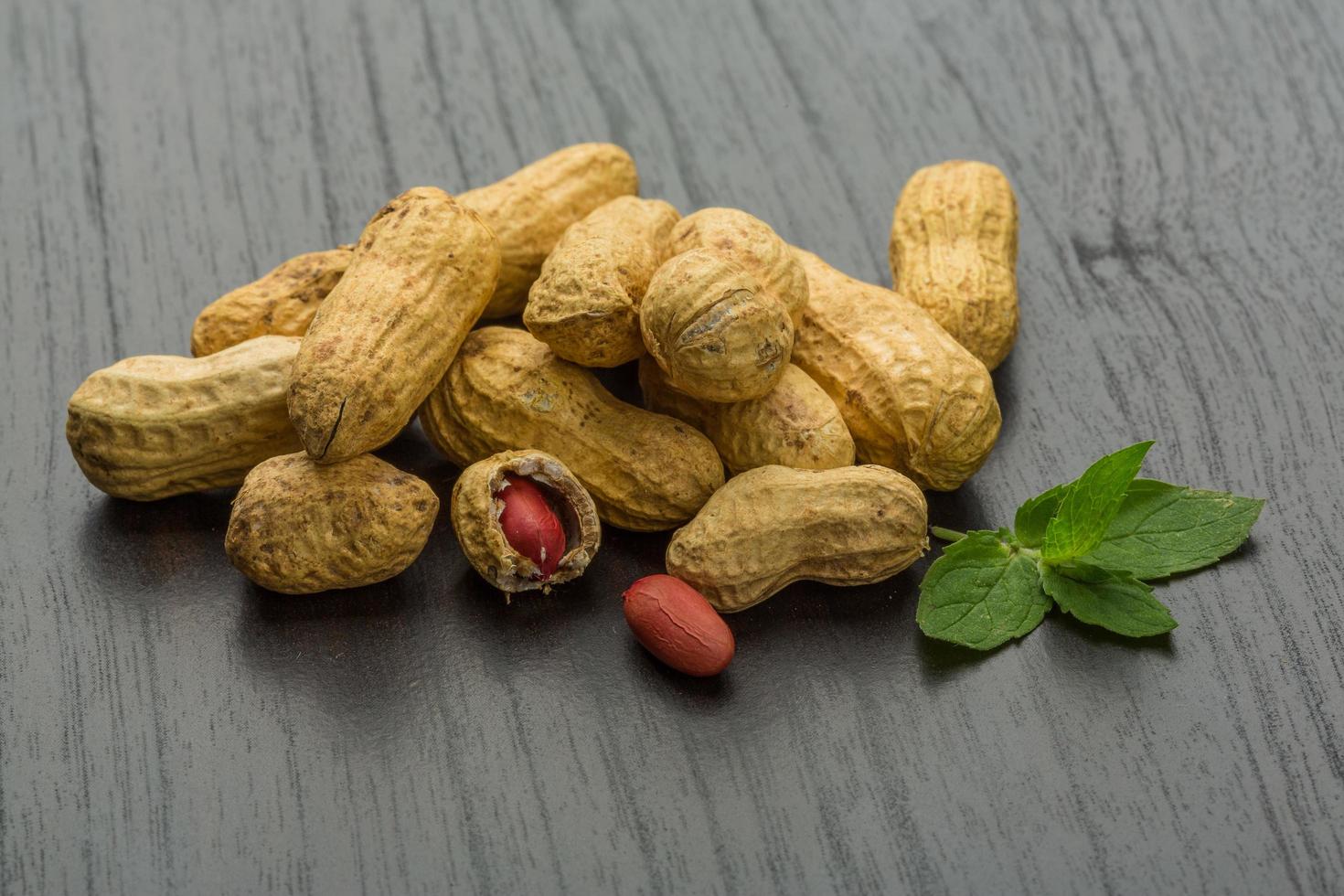 Peanut on wooden background photo