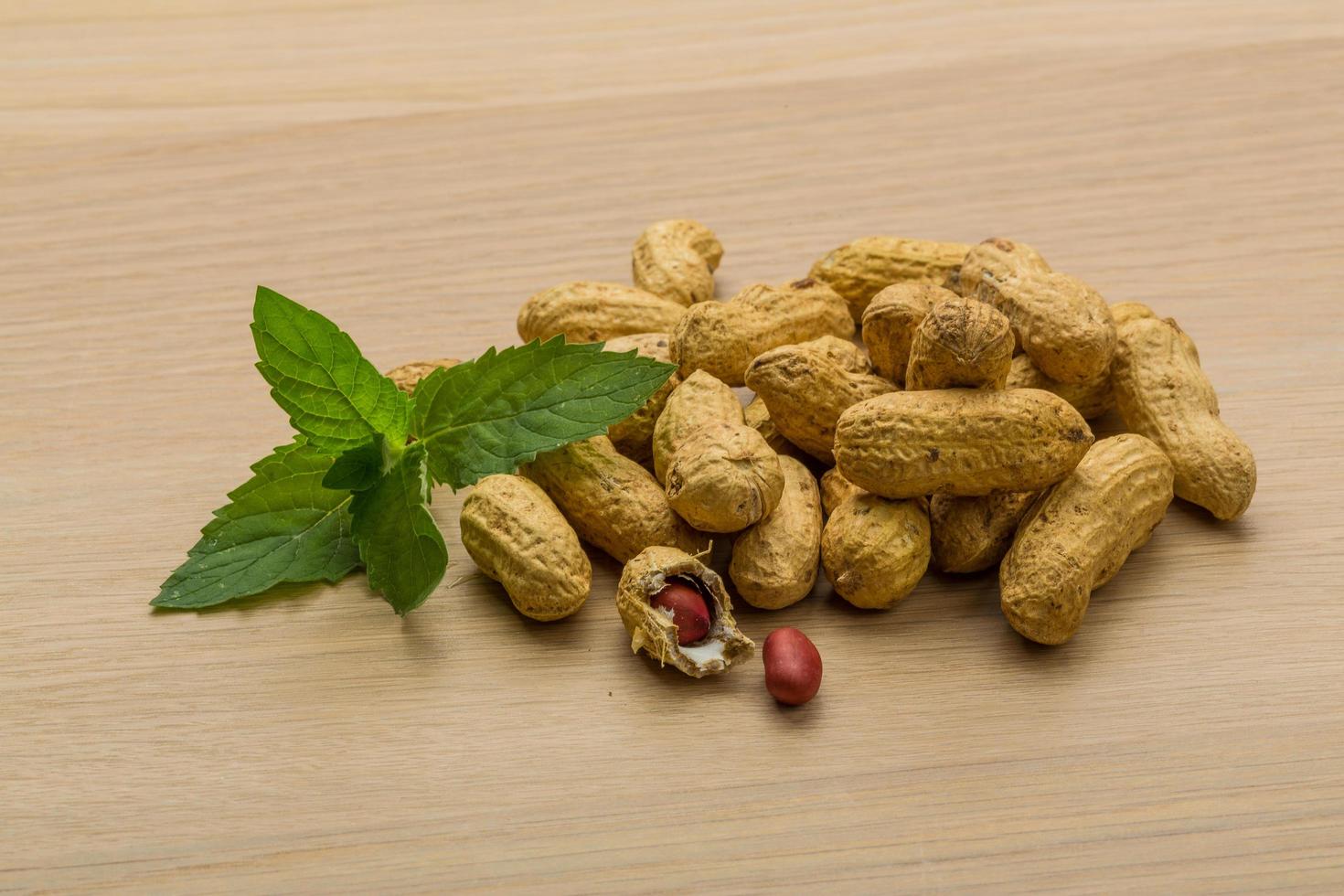 Peanut on wooden background photo