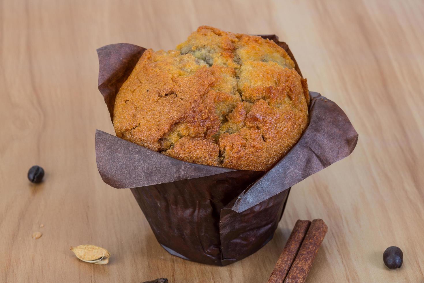 Muffin on wooden background photo
