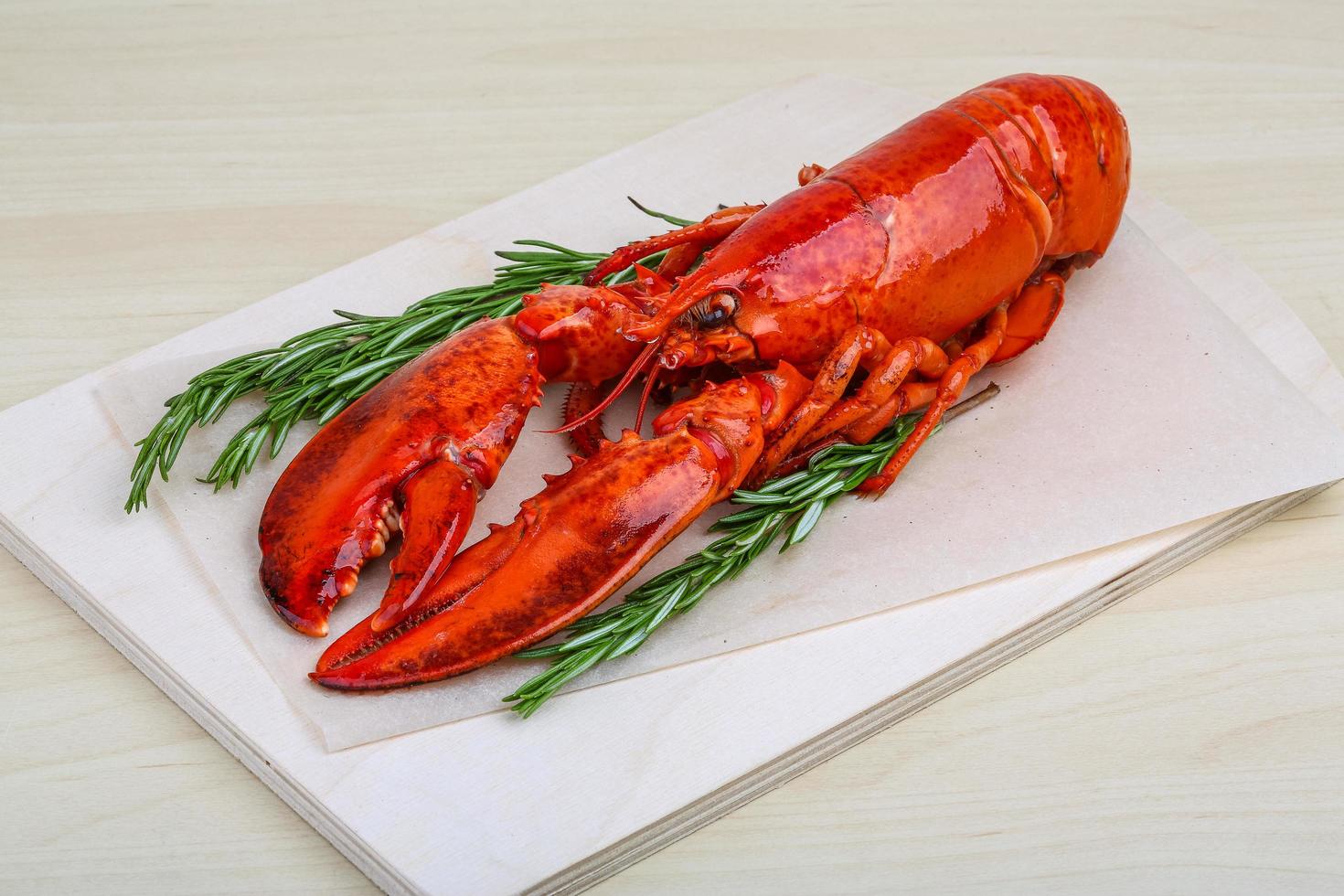 Lobster on wooden board and wooden background photo