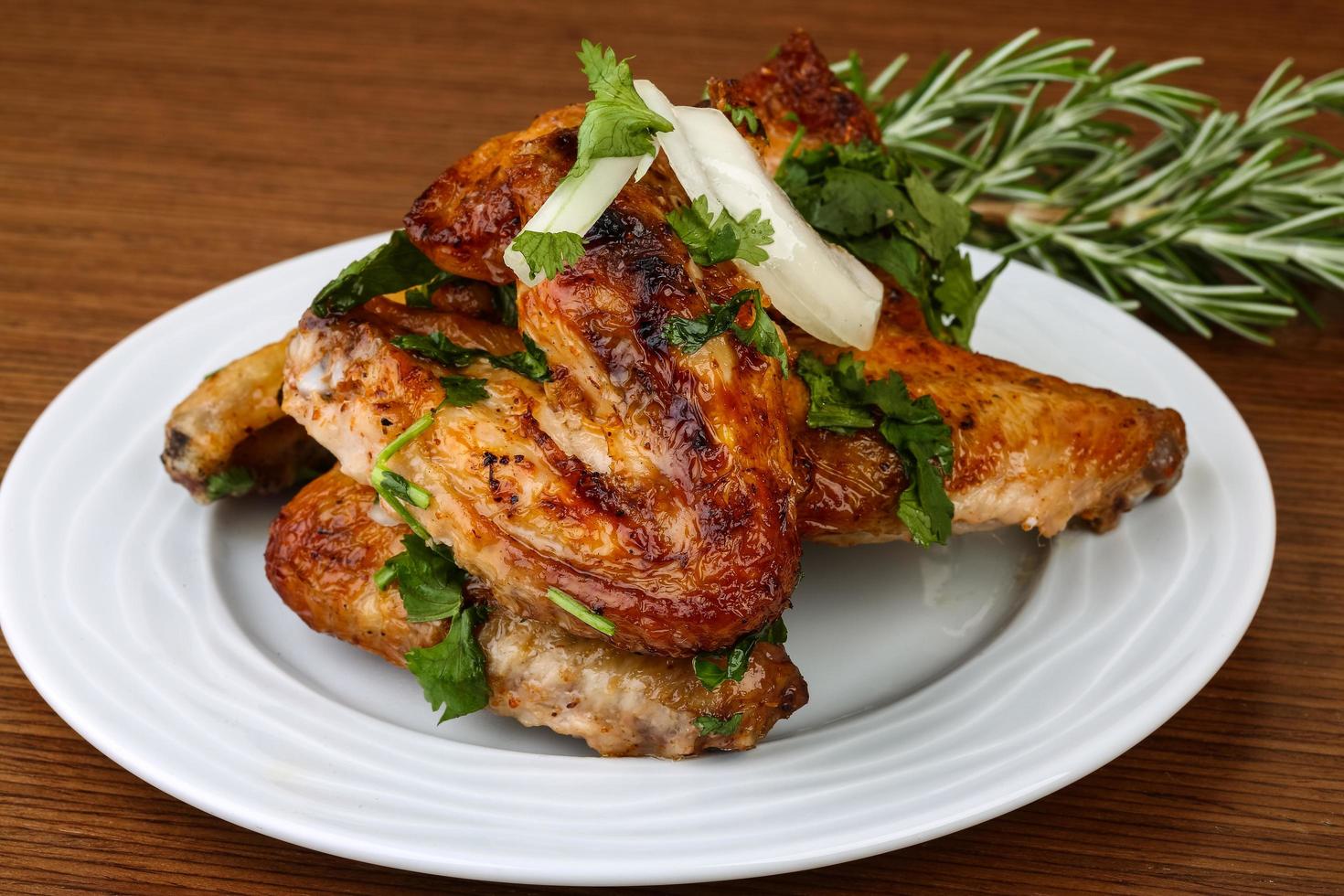 Chicken wings on the plate and wooden background 12530847 Stock Photo