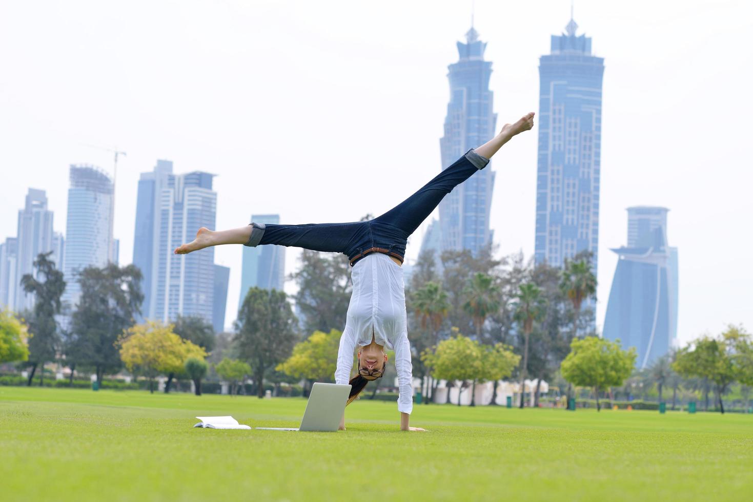 woman with laptop in park photo