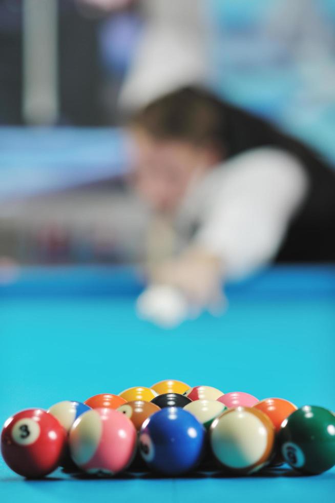 young man play pro billiard game photo