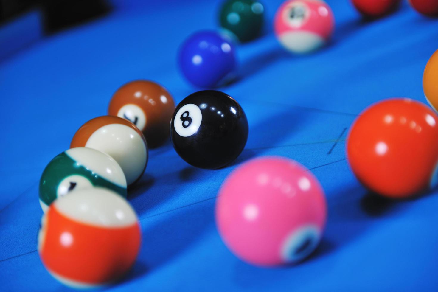 young man play pro billiard game photo