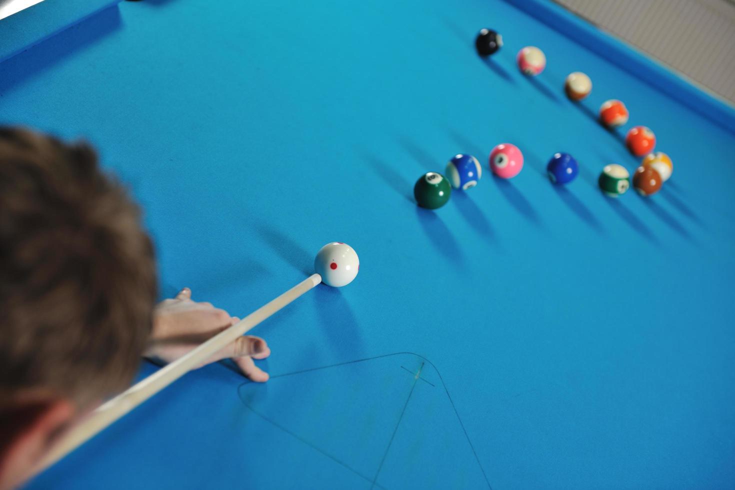 young man play pro billiard game photo