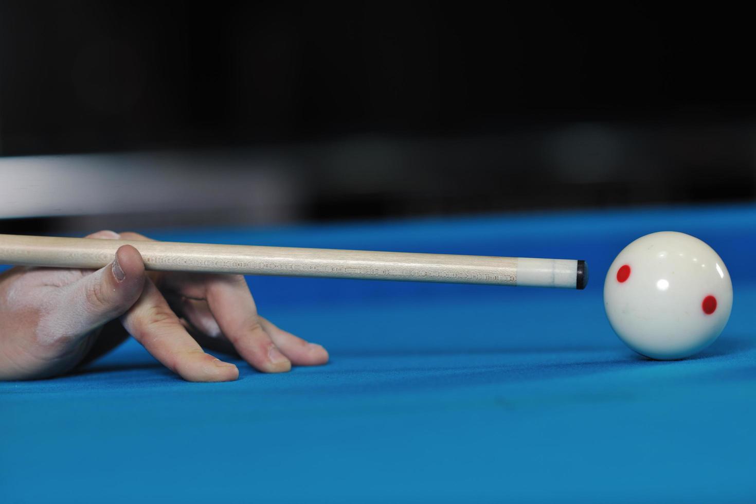 young man play pro billiard game photo