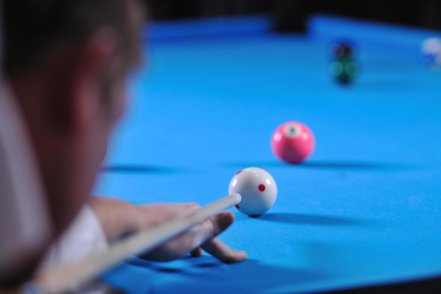 young man play pro billiard game photo