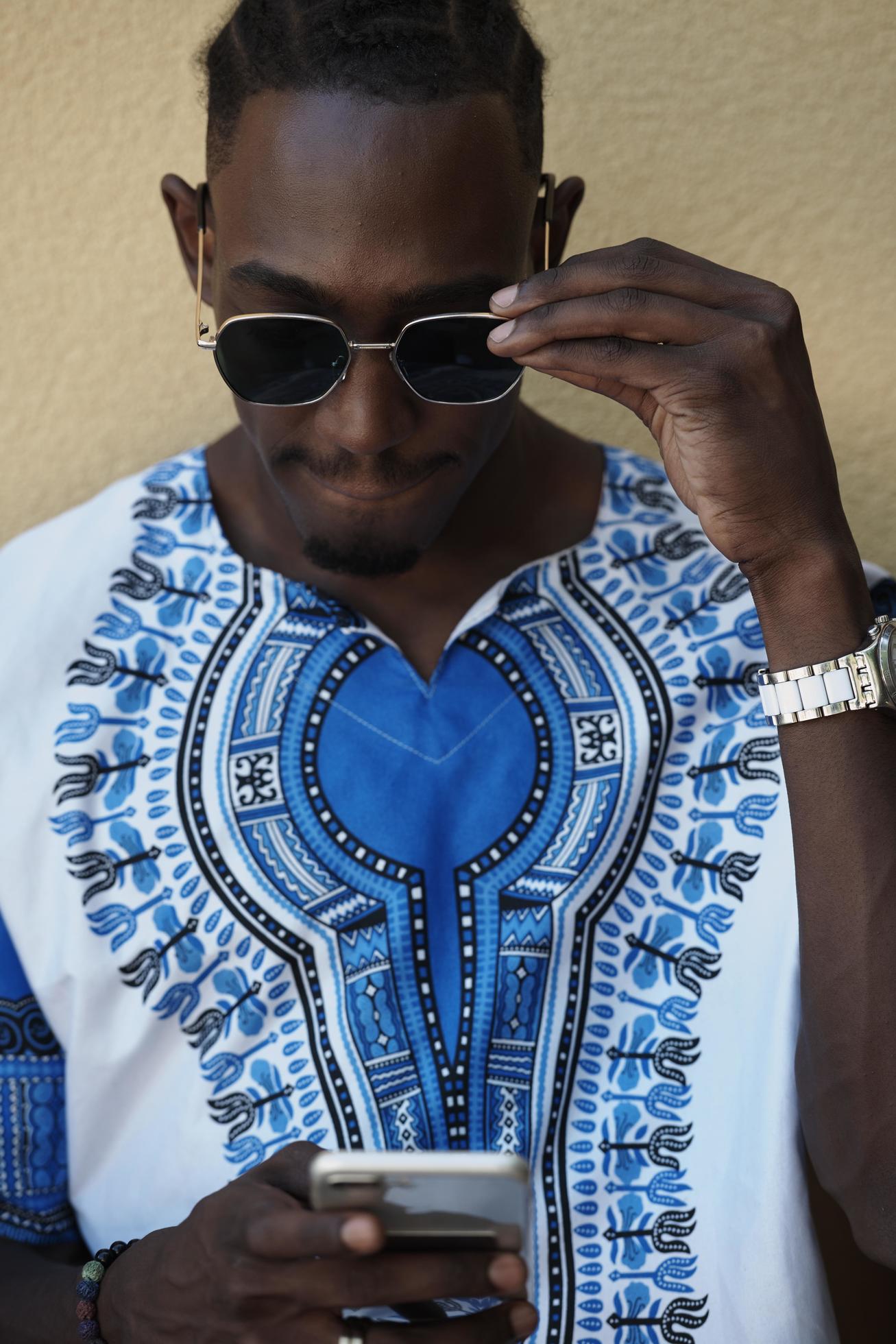 native african black man using smart phone 12532065 Stock Photo at Vecteezy