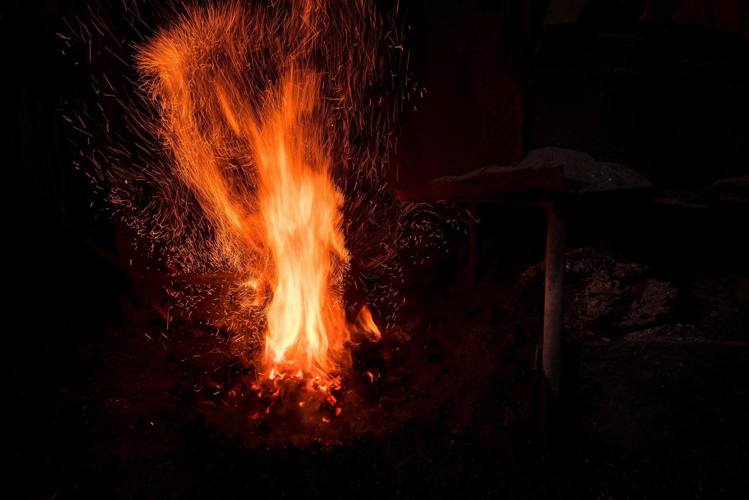 Traditional blacksmith furnace with burning fire photo