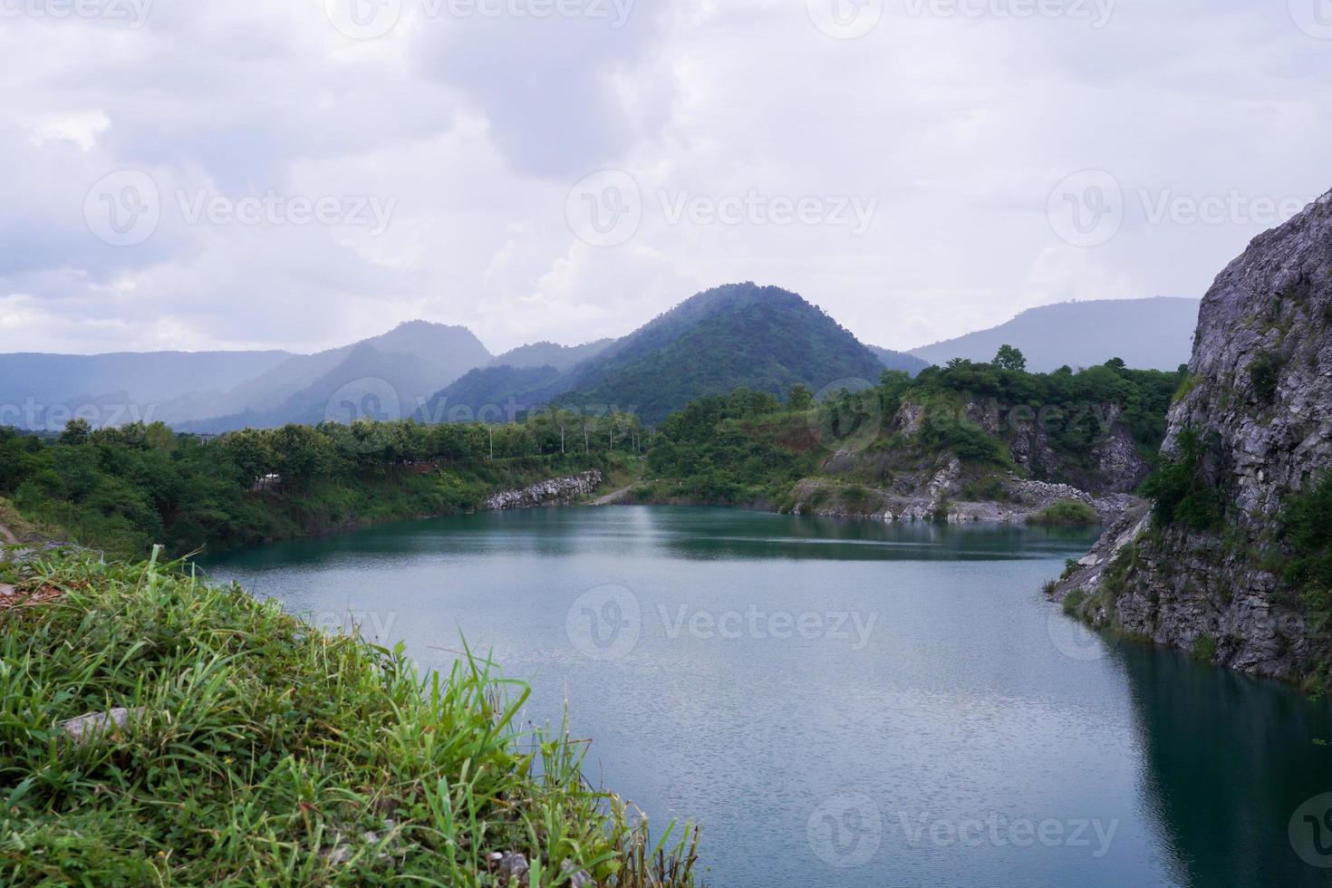 The limestone mountains after the concession explosion during the rainy season form a large and beautiful pond. photo