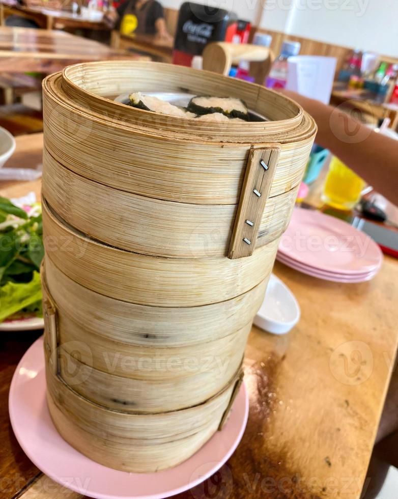 Dim sum top view and text input area, dim sum Chinese food in steamed bamboo is popular all over the world. photo