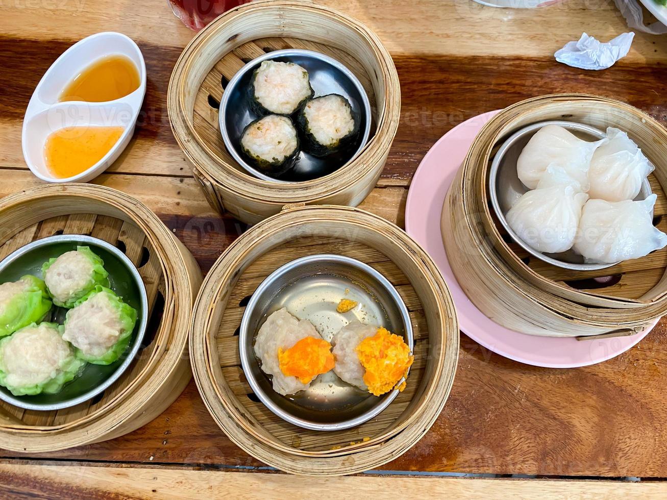 Dim sum top view and text input area, dim sum Chinese food in steamed bamboo is popular all over the world. photo