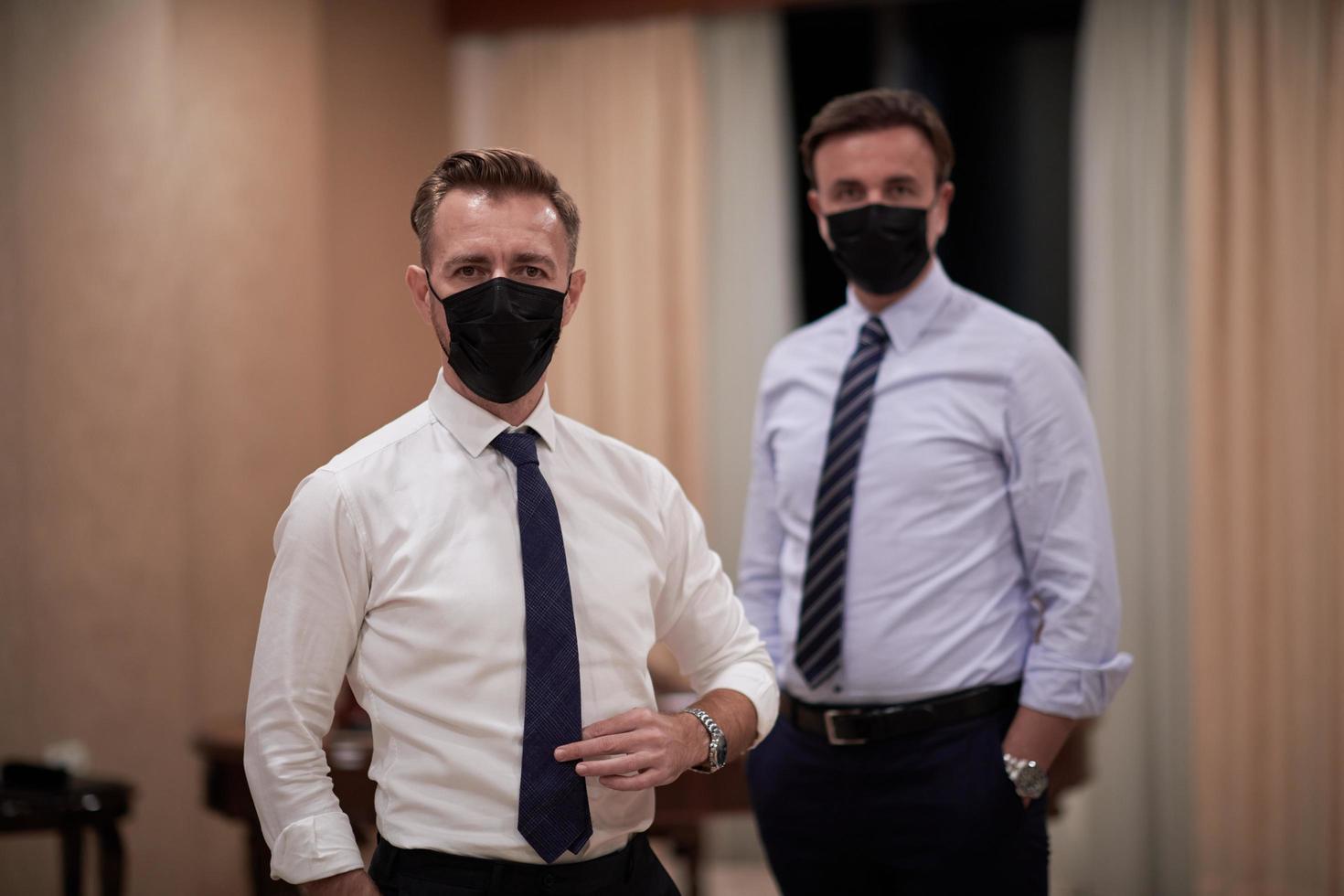 business team wearing crona virus protection face mask photo