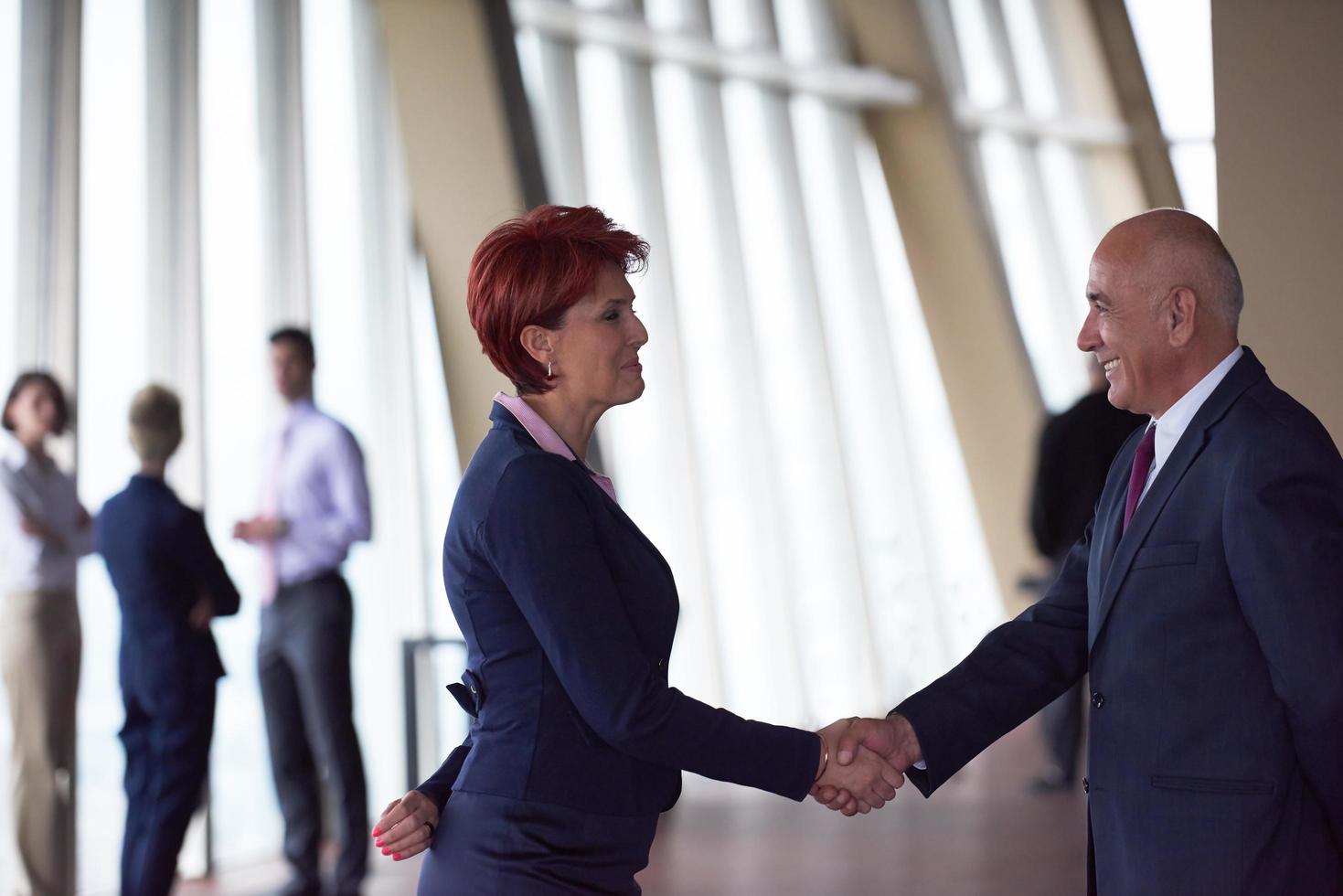 handshake of business woman and man photo
