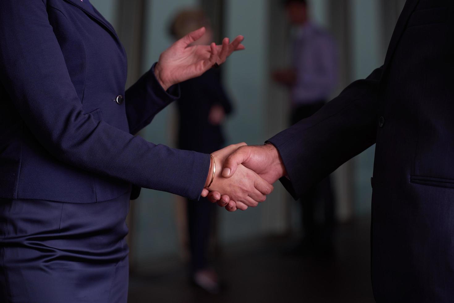 handshake of business woman and man photo