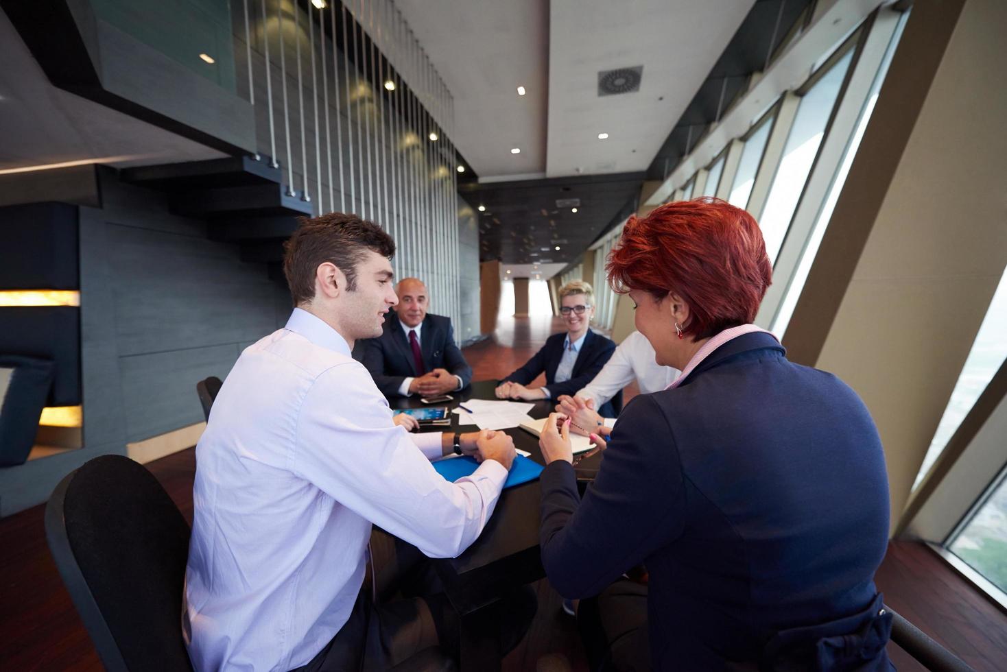 business people group on meeting at modern bright office photo