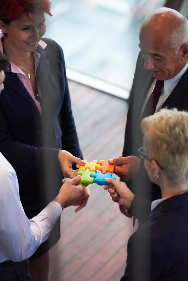 assembling jigsaw puzzle 12533978 Stock Photo at Vecteezy