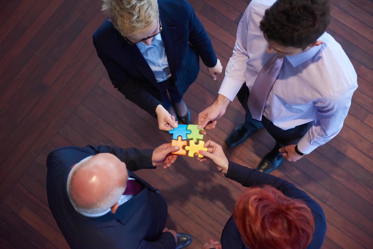 assembling jigsaw puzzle 12533983 Stock Photo at Vecteezy