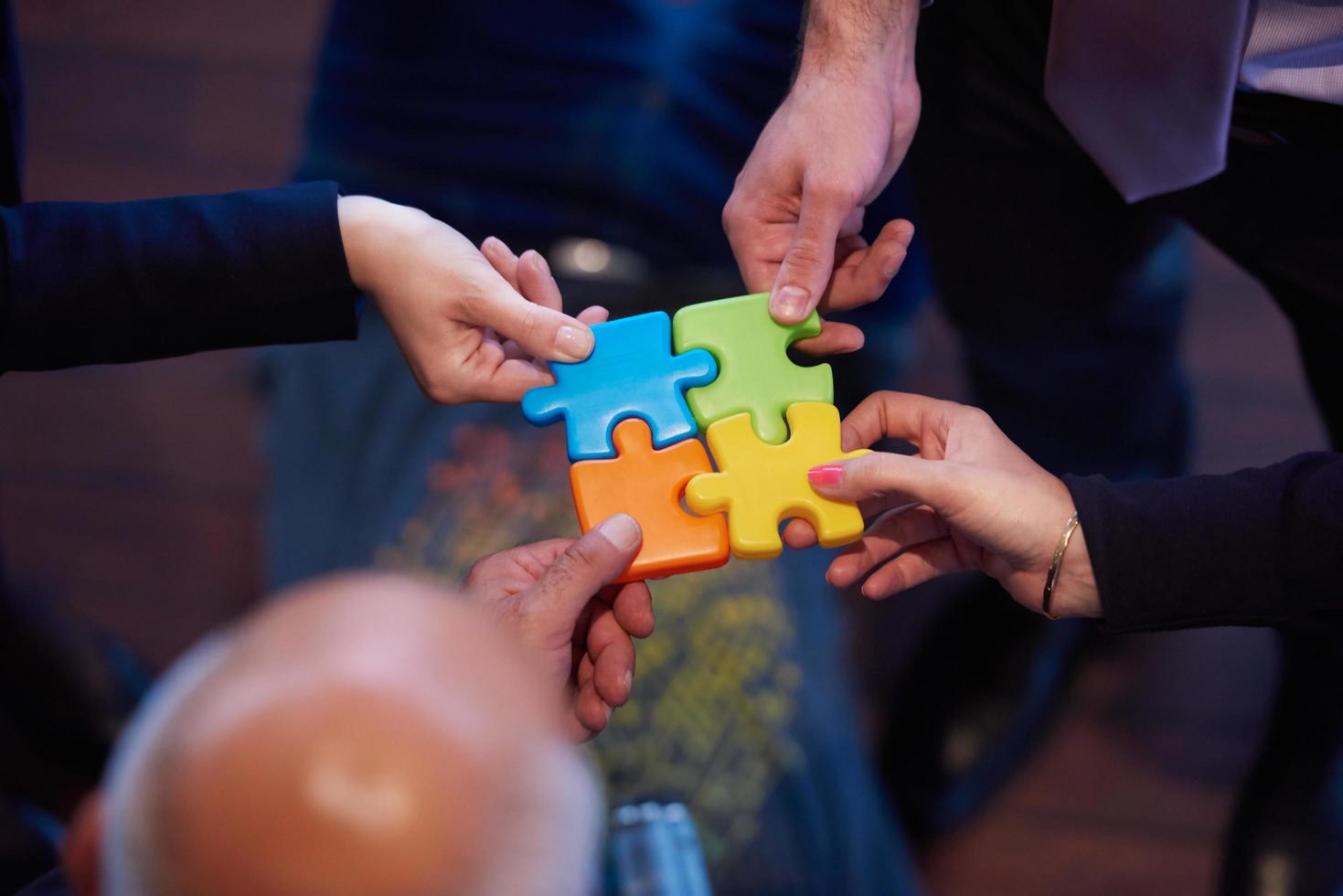 assembling jigsaw puzzle 12533996 Stock Photo at Vecteezy