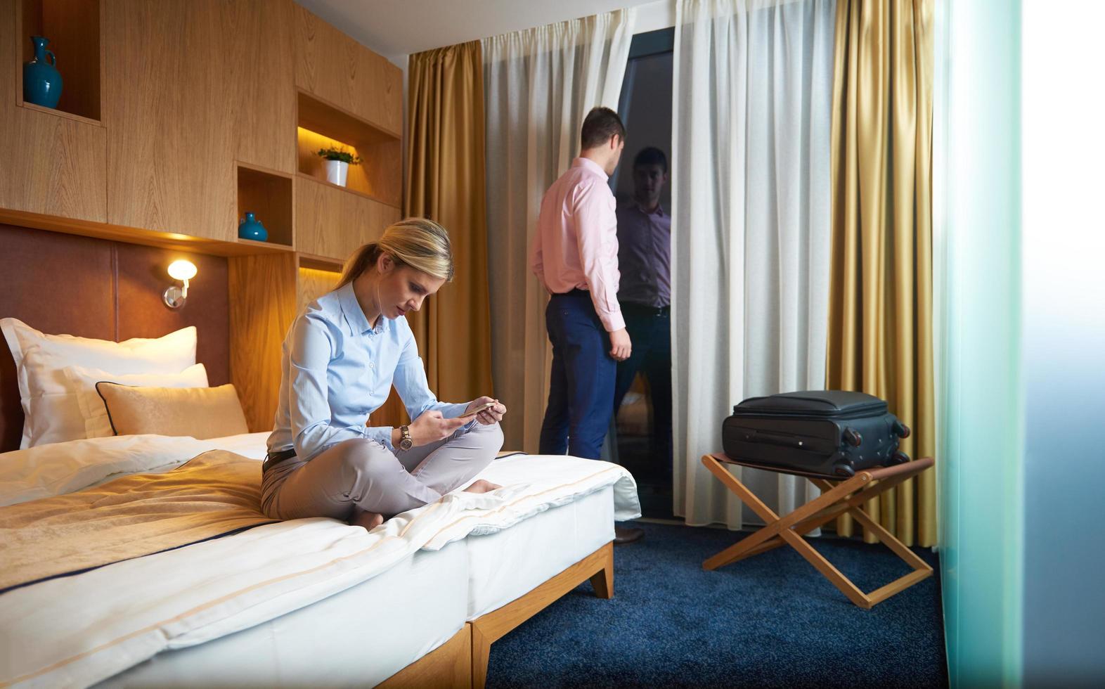 young couple in modern hotel room photo