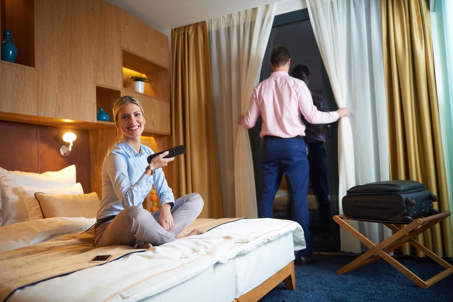 young couple in modern hotel room photo