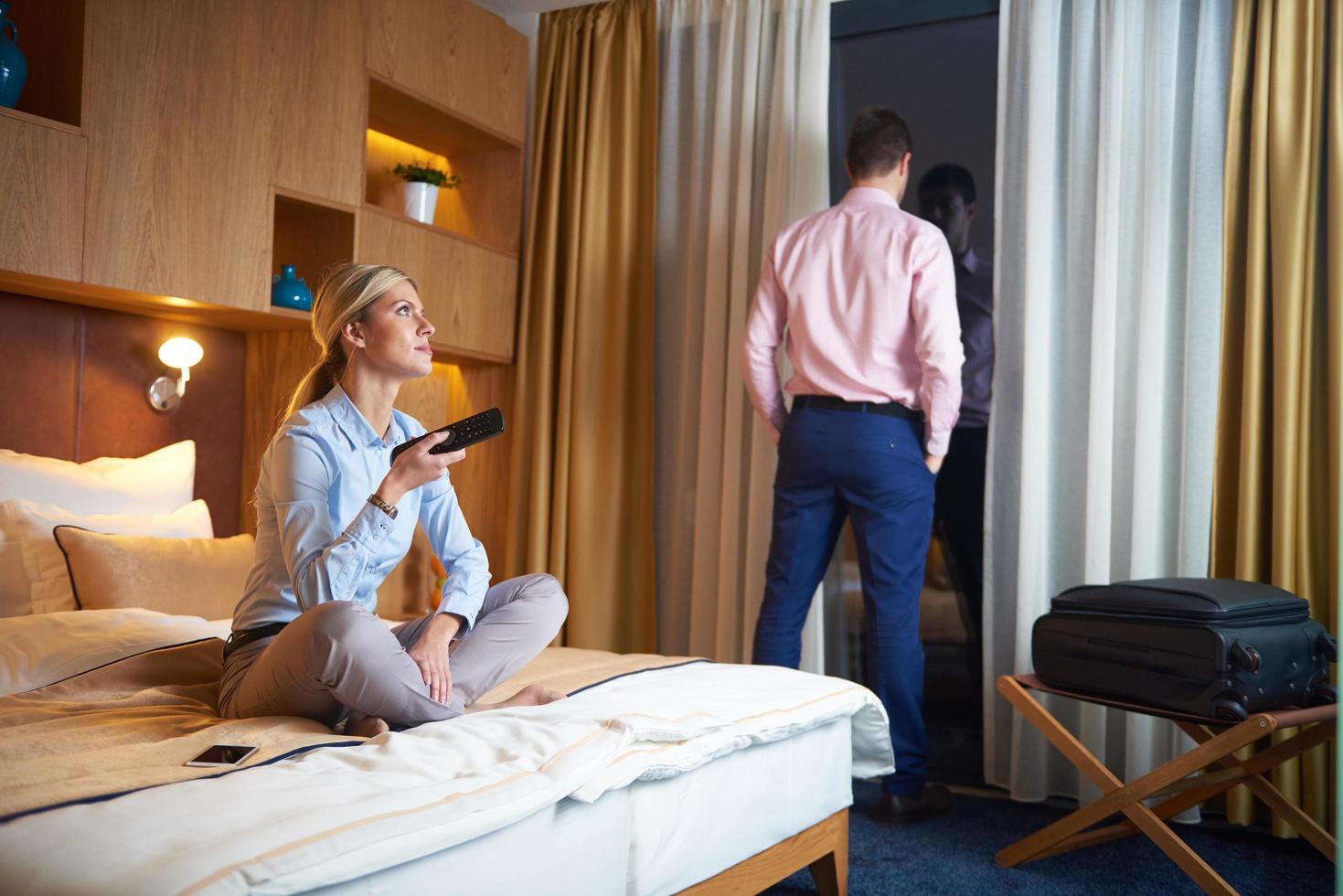 young couple in modern hotel room photo