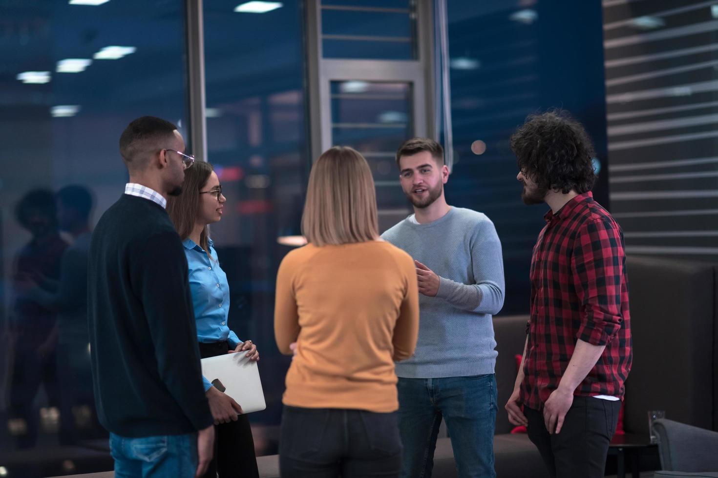 Successful team. Group of young business people working and communicating together in creative office. Selective focus photo