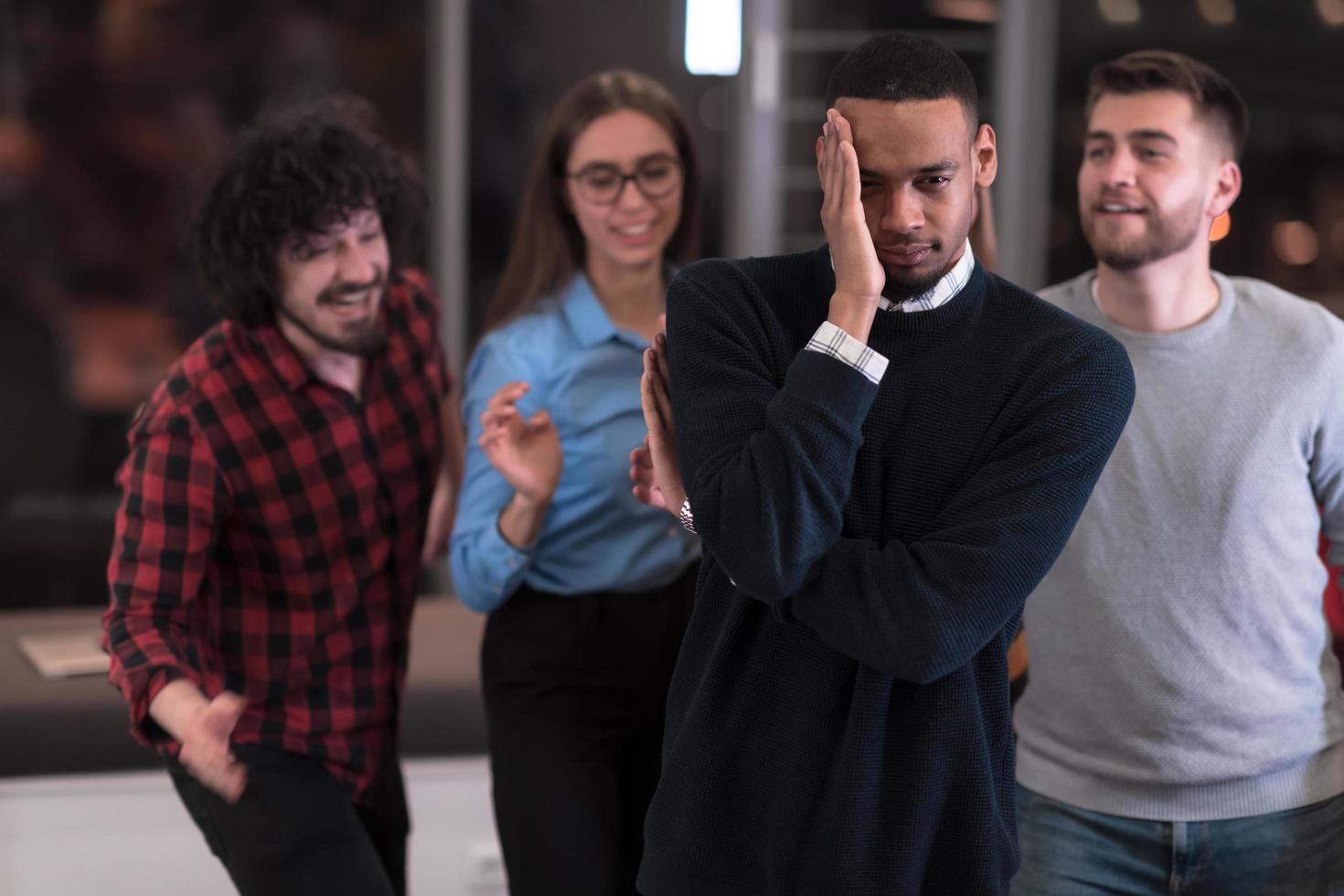 A group of young business people have fun playing interesting games while taking a break from work in a modern office. Selective focus photo