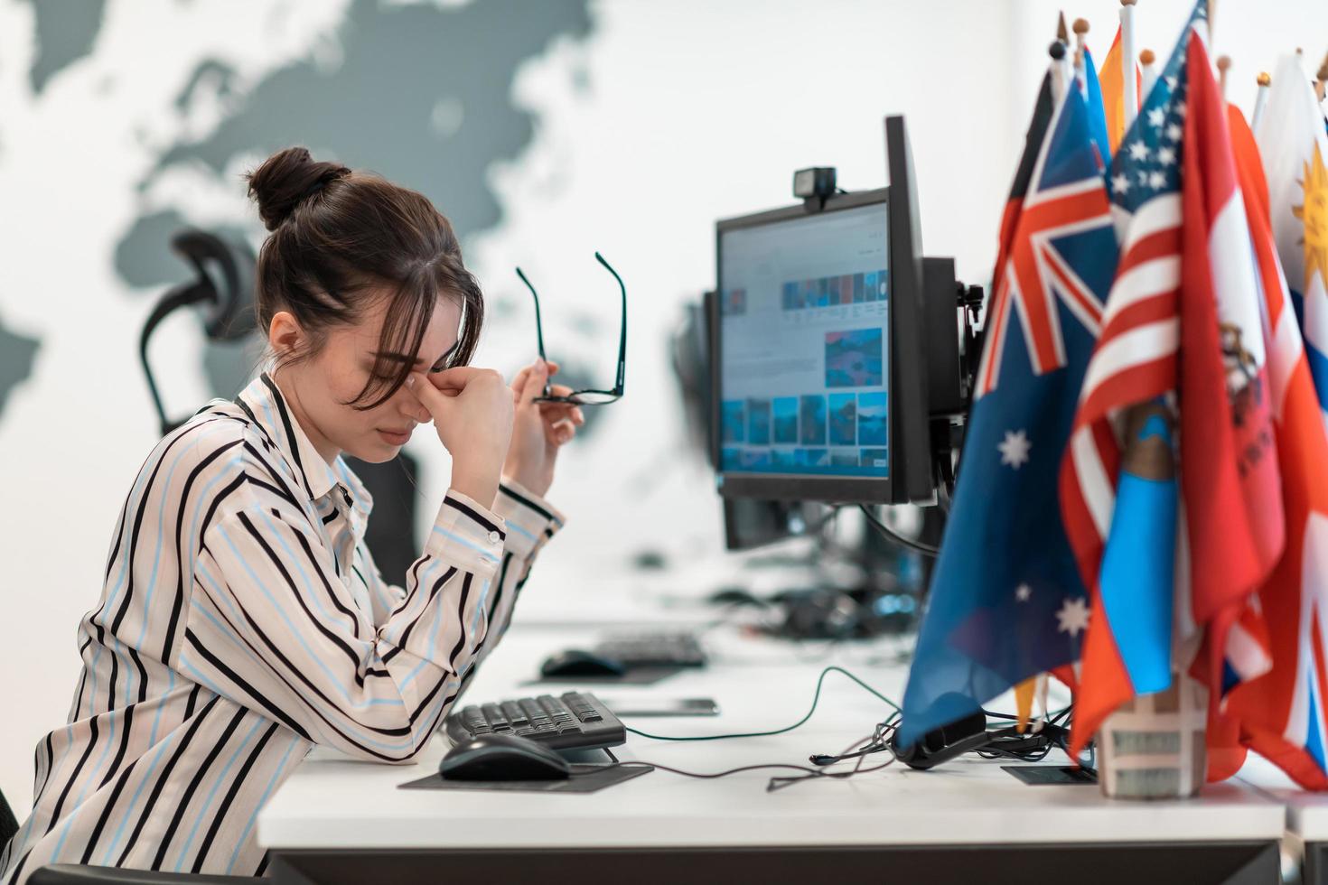 Beautiful Shocked and Annoyed Young Woman Looking her Laptop. Sad Operator Agent Woman Working from Home in a Call Center photo
