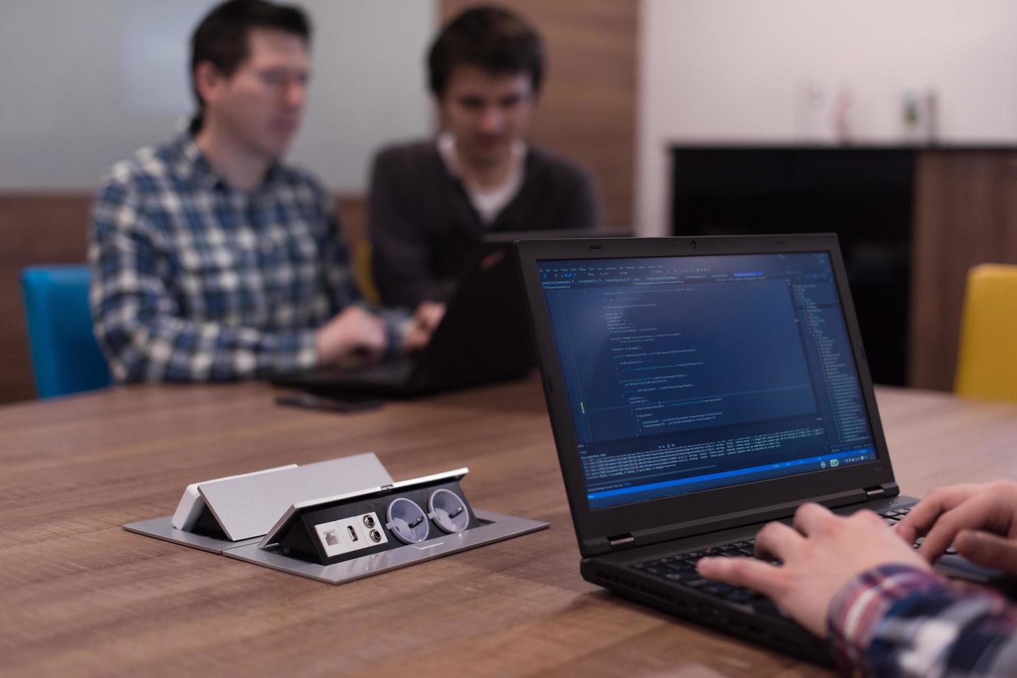 programmer writing programming code photo