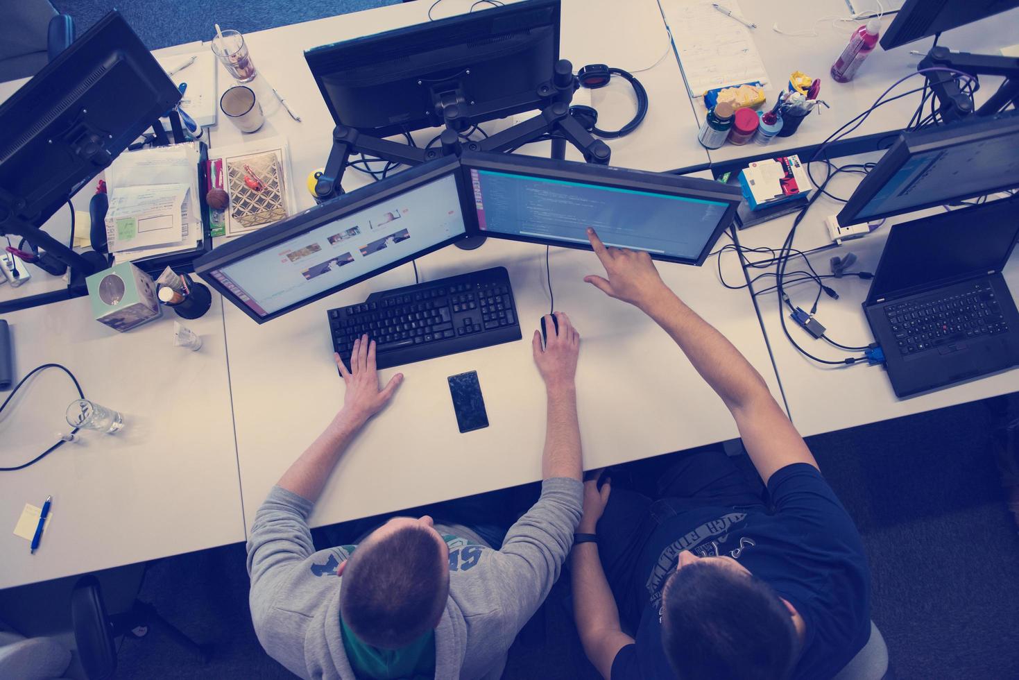 young programmers writing programming code top view photo