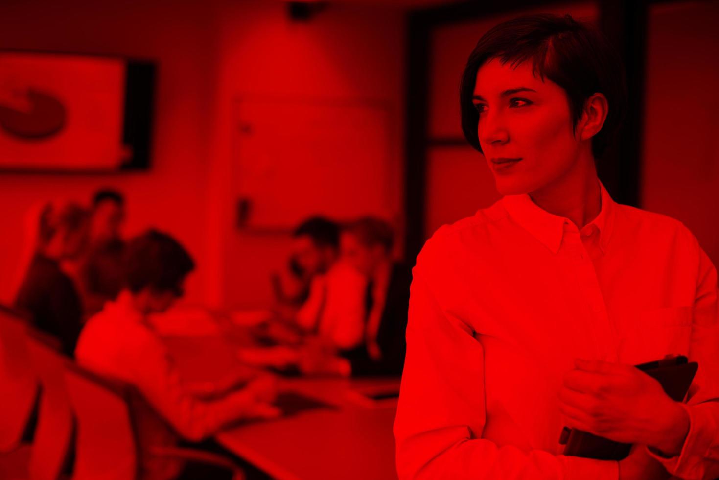 hispanic businesswoman with tablet at meeting room photo