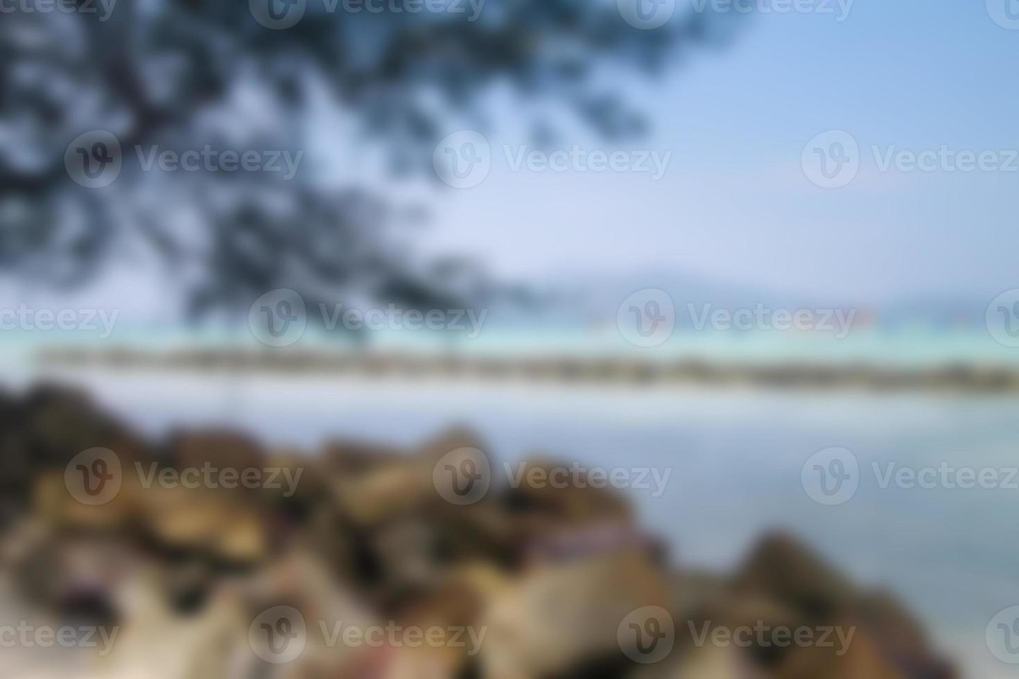 Blurred background, view tropical beach with sun light wave abstract background. Travel concept. photo