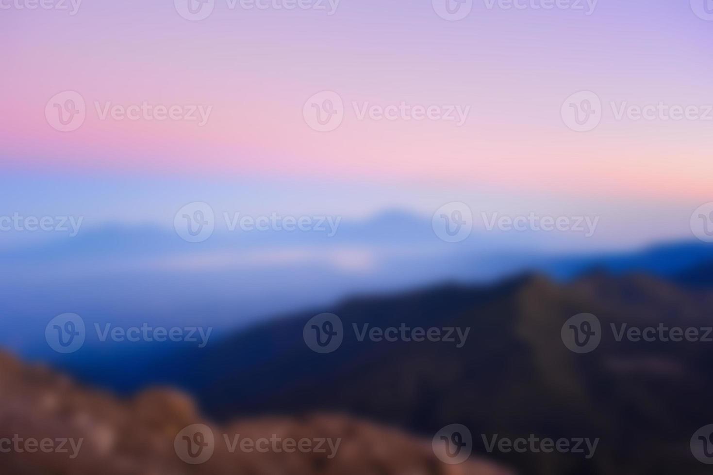 Blurred landscape blue sky with clouds, beautiful fantasy pastel colorful landscape background, gradient sky, sunrise with mountains in distant photo