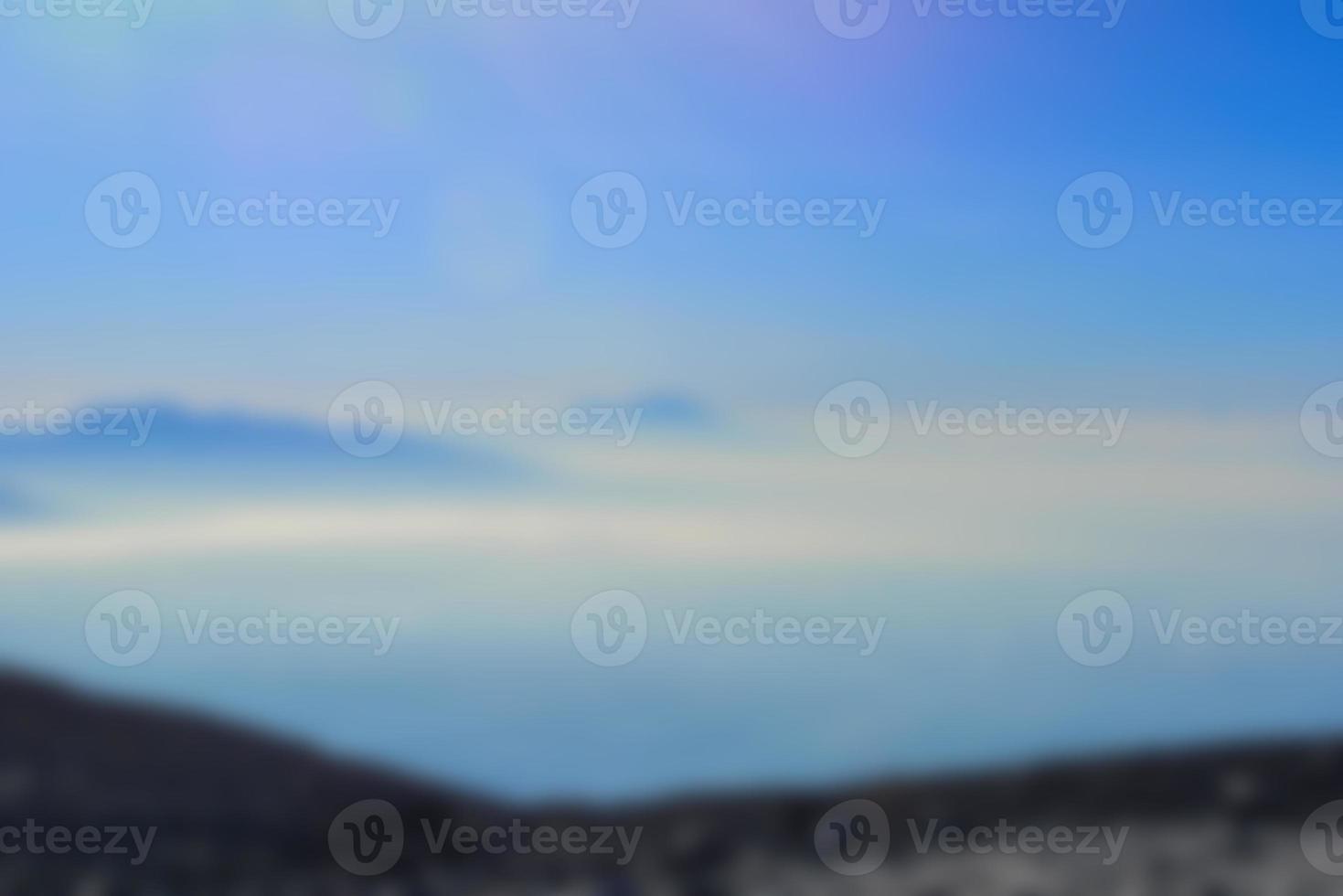 Blurred landscape blue sky with clouds, beautiful fantasy pastel colorful landscape background, gradient sky, sunrise with mountains in distant photo