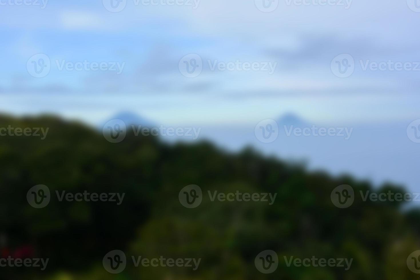 Blurred landscape blue sky with clouds, beautiful fantasy pastel colorful landscape background, gradient sky, sunrise with mountains in distant photo