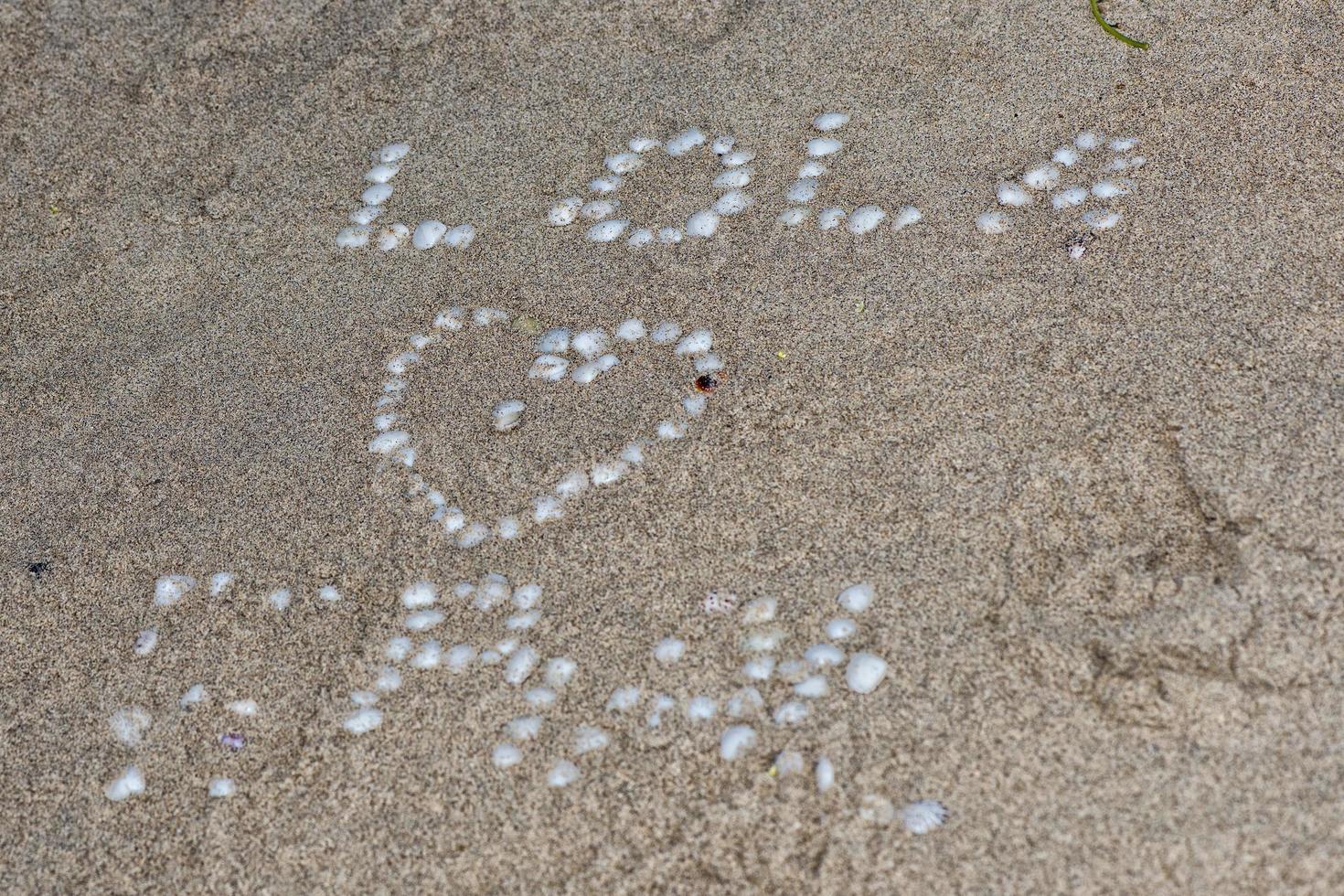 love writings made of shells photo