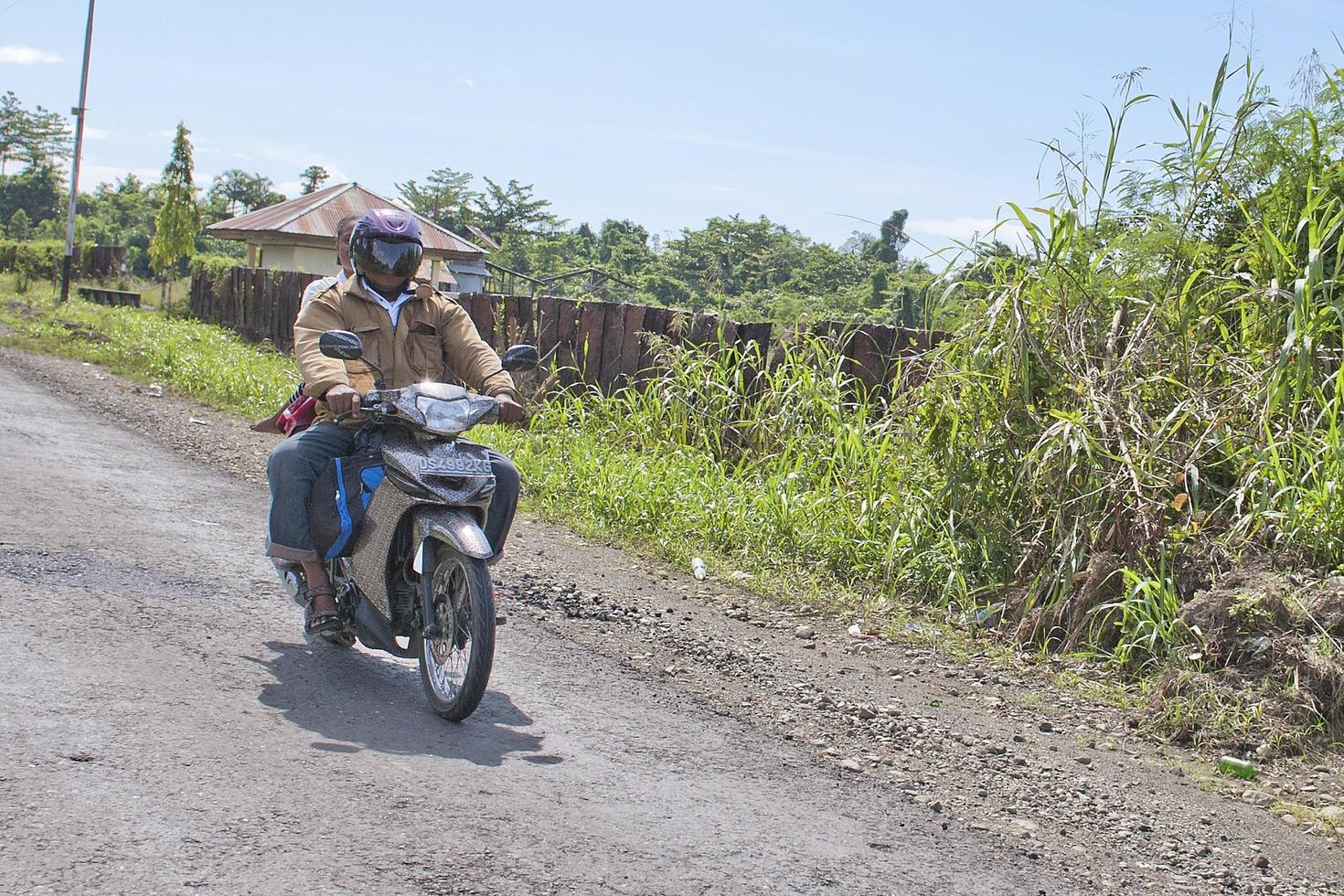 DENPASAR, BALI, INDONESIA - AUGUST 15, 2016 - Indonesia people biking photo