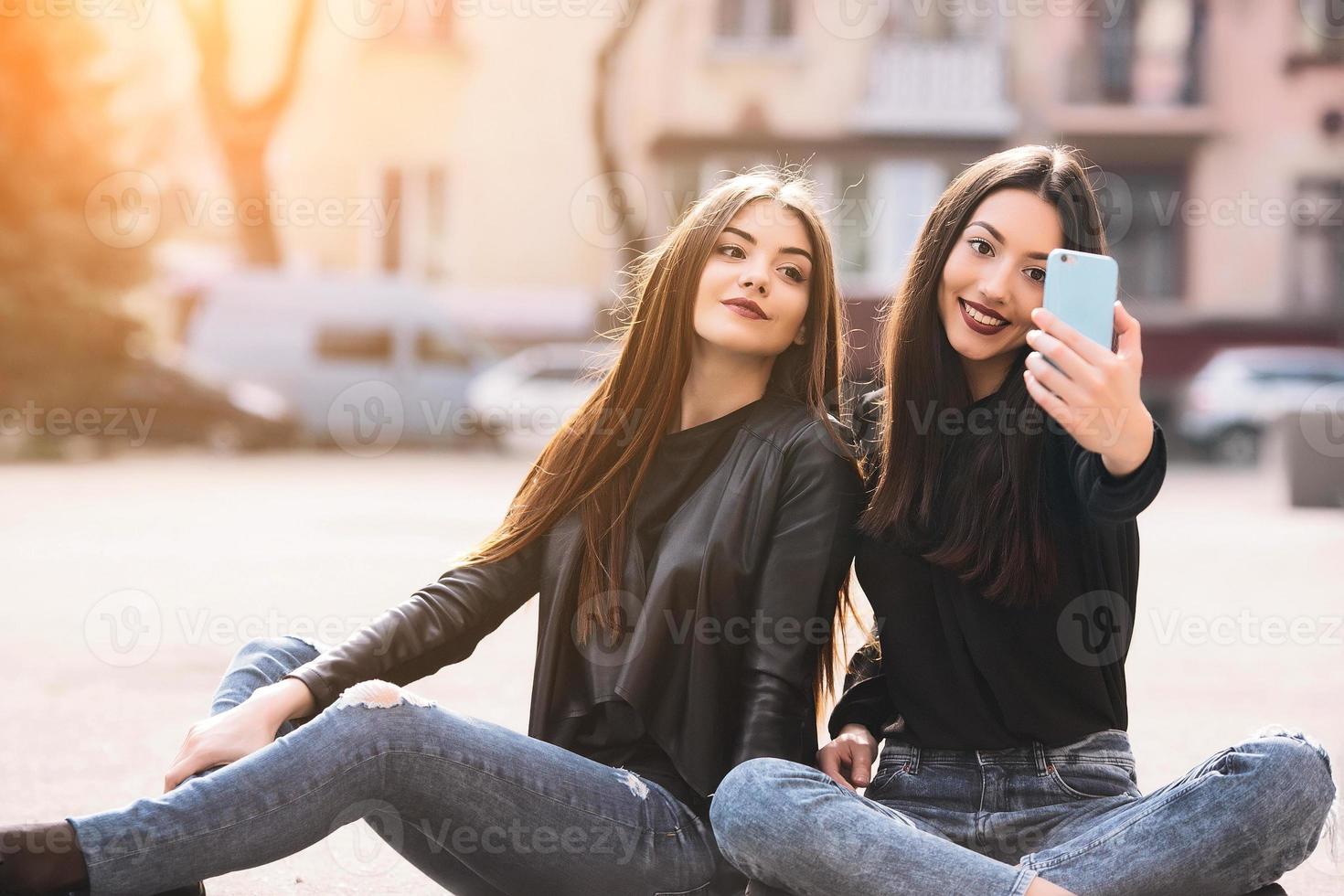 Two young adult girls photo