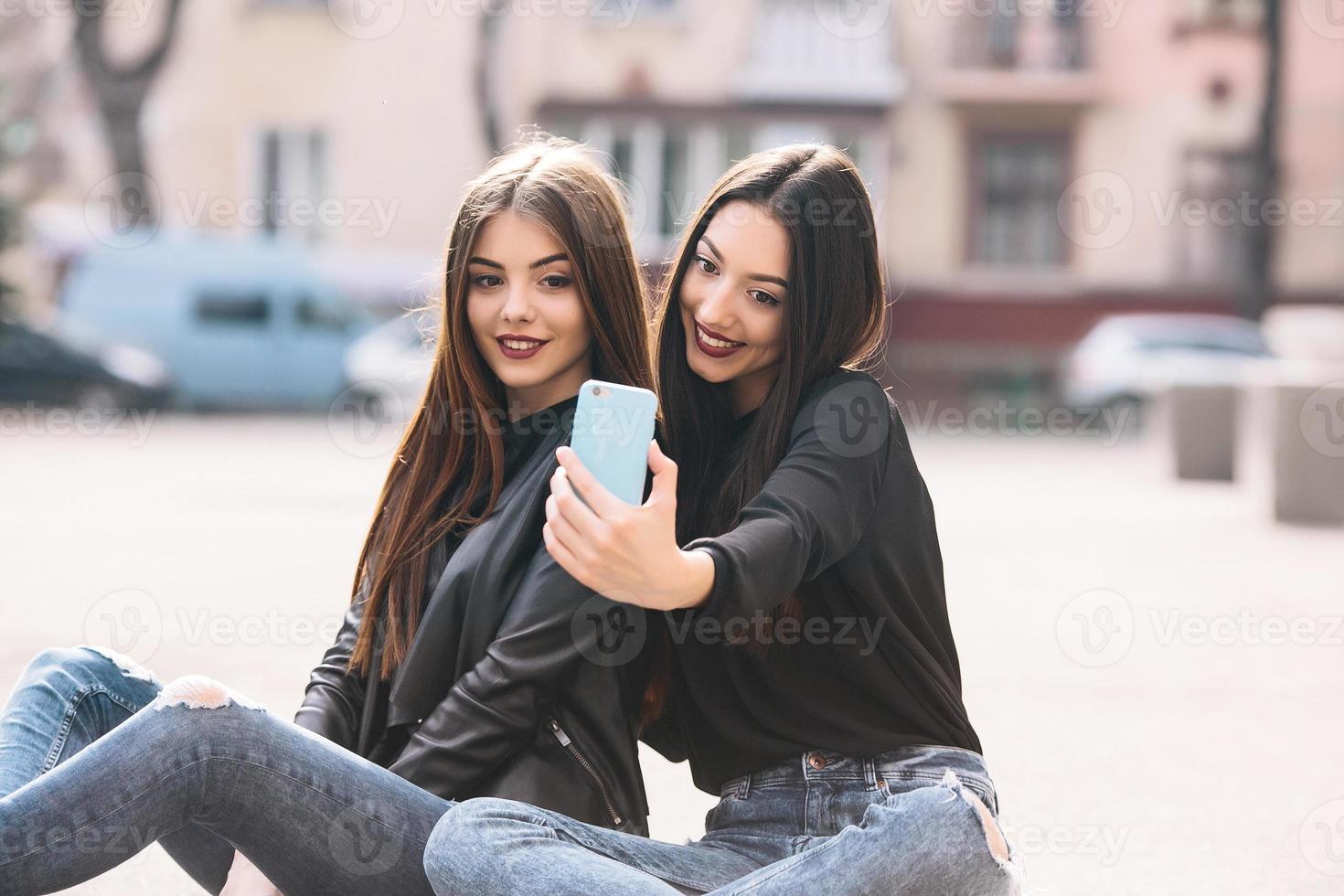 Two young adult girls photo