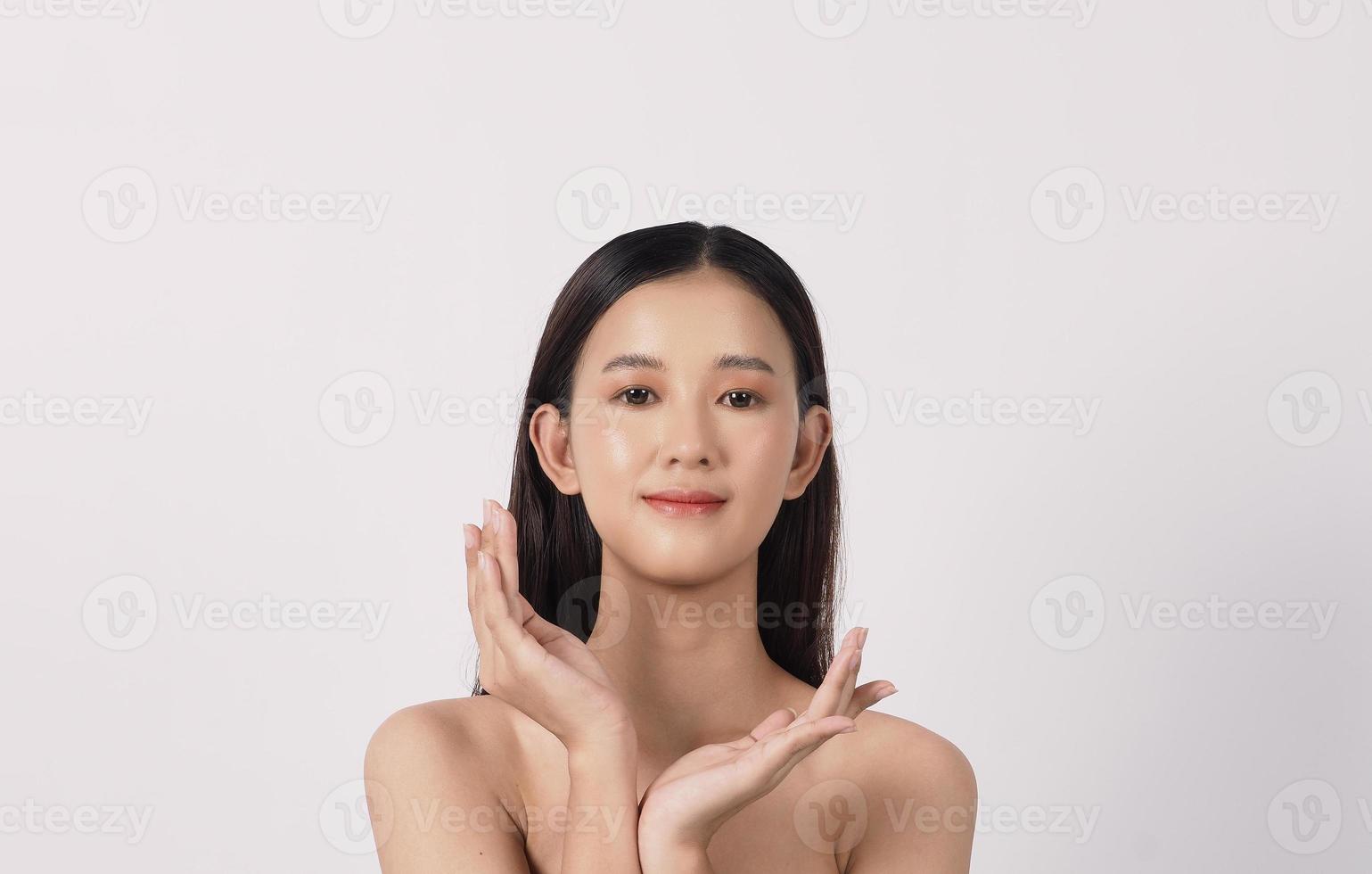 Beautiful young asian woman with clean fresh skin on white background. photo