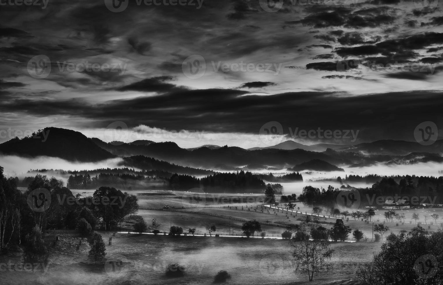 Hilly landscape with fog photo