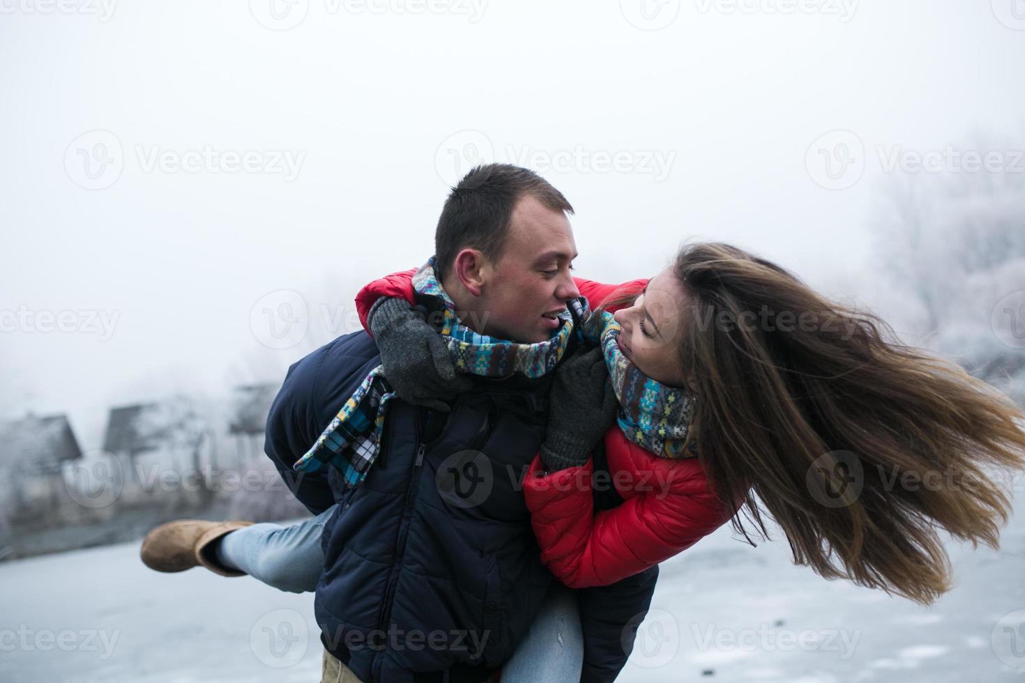 Couple in winter landscape photo