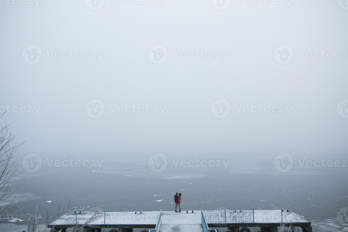 Couple in winter landscape photo