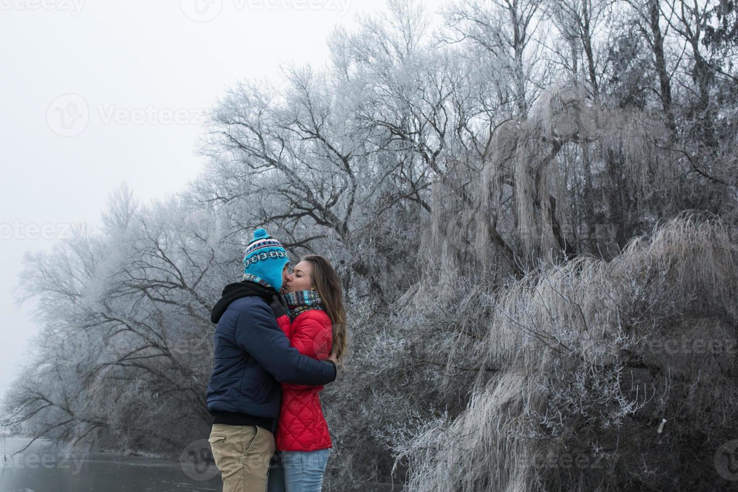 Couple in winter landscape photo